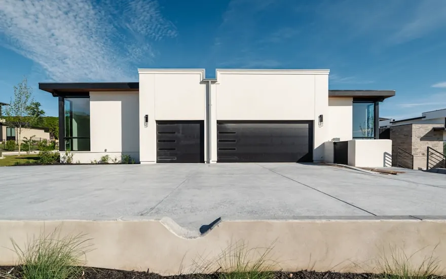 Finished two-car driveway, broom texture, clean control joints